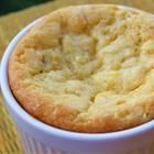 a close up of a muffin in a cup on a table