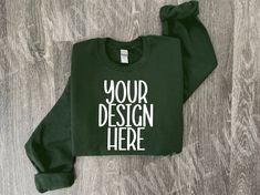 showcase your sweatshirt designs with our folded forest green Gildan 18000 model mockup photo!   ✨Details✨ This is a digital download ONLY This image is for the Gildan 18000 Sweatshirt ✨Download Includes✨ 1 high-resolution JPG free of watermark and branding. ✨Notes✨ THIS IS A DIGITAL PRODUCT, NO physical item will be delivered Once the payment is cleared through Etsy you will receive an email with the download link. You can also download it from the Profile Purchases via Etsy. ✨Terms of Use ✨ THE FOLLOWING PERMISSIONS ARE HEREBY GRANTED TO THE LICENSEE: - You may place your graphic or logo onto the image. - You may crop or rotate the image as needed. - Personal and commercial use is permitted. THE FOLLOWING ACTIONS ARE STRICTLY PROHIBITED - You do not have permission to resell this image. Green Branded Sweatshirt For Winter, Green Branding Sweatshirt For Fall, Customizable Green Long Sleeve Sweatshirt, Customizable Long Sleeve Green Sweatshirt, Customizable Green Long Sleeve T-shirt, Customizable Long Sleeve Green T-shirt, Green Branded Sweatshirt For Fall, Green Sweatshirt With Branding For Fall, Green Cotton Sweatshirt With Custom Print