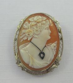 Ornate Oval Carved Brooches, Ornate Carved Oval Brooches, Ornate Cameo Brooch For Anniversary, Ornate Cameo Brooches For Anniversary, Art Nouveau Oval Cameo Jewelry, Ornate Cameo Jewelry For Anniversary, Art Nouveau Cameo Jewelry Gift, Ornate Cameo Brooch, Victorian Cameo Brooch For Anniversary