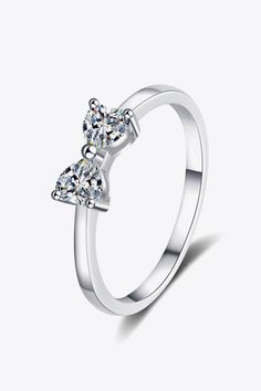 Moissanite Bow Rhodium-Plated Ring - Trendha Flatlay Styling, Bow Ring, Triangle Pendant, Stylish Rings, Moissanite Earrings, Moissanite Jewelry, Trends 2024, Moissanite Rings, Sterling Silver Bands