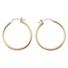 14 Karat Yellow Gold Hoop Earrings- These classic gold hoops are a timeless addition to your collection. Size: 29.8 mm x 2.3 mm x 2.4 mm. Stamped: 14K Weight: 1.0 dwt./ 1.6 gr. Very good condition, professionally polished. Will come packaged in a gift box or pouch (when possible) and will be shipped U.S. Priority Mail Insured. AD0223202417KCS