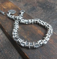 Handmade unisex oxidized sterling silver bracelet with beads (6 mm). It is available with either raw (unpolished) or polished silver finish - the photos show the raw bracelet. We offer bracelets in many sizes: 6" (15 cm), 6.5" (16,5 cm), 7" (18cm), 7.5" (19 cm), 8" (20,5 cm) 8.5" (21.5 cm), 9" (22.5 cm).  Choose the one that is most similar for your wrist circumference and share your actual wrist circumference in the note to your order. This way we can perfectly adjust the size of your bracelet. Minimalist Oxidized Bracelets For Everyday, Everyday Minimalist Oxidized Bracelets, Rustic Silver Bracelet Jewelry, Oxidized Silver Bracelet, Bracelet With Beads, Polish Silver, Oxidized Silver, Oxidized Sterling Silver, Sterling Silver Bracelet