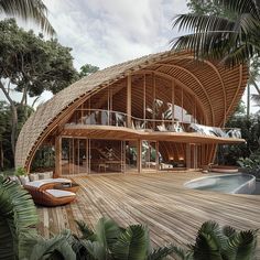 a large wooden structure sitting on top of a lush green forest next to a swimming pool