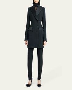 Dolceamp;Gabbana tuxedo jacket dress    Peak lapels; doublebreasted    Long sleeves; button cuffs    Tailored fit    Waist flap pockets    Sheath silhouette    Mini length    Virgin wool/polyester/silk    Made in Italy Luxury Long Sleeve Formal Pantsuit, Tuxedo Style Semi-formal Pantsuit With Double Button Closure, Semi-formal Tuxedo Style Pantsuit With Double Button, Fitted Blazer Dress With Structured Boning And Suit Collar, Tailored Long Sleeve Tuxedo Pantsuit, Fitted Jacket Dress With Double Button And Notch Lapel, Fitted Jacket Dress With Notch Lapel For Evening, Elegant Evening Jacket Dress With Hidden Button Closure, Fitted Notch Lapel Jacket Dress With Double Button