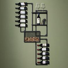 a wall mounted wine rack with bottles and glasses