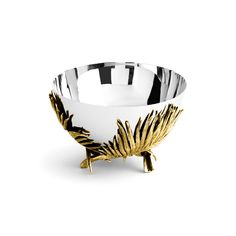 a white and gold bowl with leaves on it