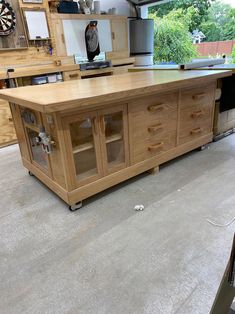 a kitchen island made out of wood in a garage