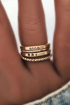 Beautiful dainty stacking name rings set, including personalized name rings and dainty gold stacking rings. This gold filled set is a great gift for mom or grandma! Discover our beautiful kids name ring stacks, the perfect sentimental gift for mom's birthday or moms-to-be! These stackable kids name rings pair perfectly with dainty gold rings & are the perfect simple meaningful jewelry pieces to add to your collection. Shop all of our custom personalized jewelry and gold name rings here! Name Rings Silver, Ring Kids, Sentimental Gifts For Mom, Mom Jewelry Personalized, Gold Stacking Rings, Ring Stacks, Personalized Memorial Gifts, Personalized Engraved Gifts, Gold Rings Simple