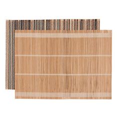 two placemats made out of bamboo with black and white stripes on each side