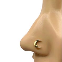 a gold nose ring with a crescent design on the front and back of it's face