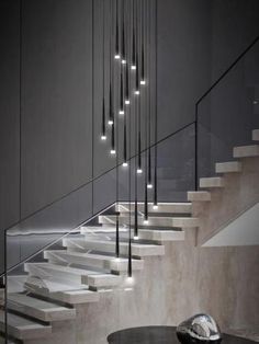 an image of a staircase with lights on it