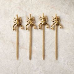 Cast brass scorpion cocktail picks add a playful garnish to cocktails and canapes. A CB2 team favorite, this set of four makes a great gift. CB2 exclusive.  -Cast brass pick heads, stainless steel picks with a food-safe brass-colored PVD finish -Set of four -Ships in CB2 gift packaging -Made in India Scorpio Brass Cocktail Picks Set of 4 Cocktails And Canapes, Gold Planter, Unique Hostess Gifts, Glass Tealight Candle Holders, Home Bar Accessories, Cocktail Picks, White Wine Glasses, Cocktail Accessories, Black Vase