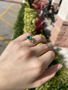 Setting Style: Solitaire / Bezel Setting Material: 14K Yellow Gold Gold Weight: 5.7 grams Main Stone: Emerald Shape: Pear Cut Weight: 2.18-carats Clarity: Semi-Transparent Color: Green Luster: Excellent - Very Good Origin: Brazil Estimated retail value: $7,120.00 USD! If you have a special request for a custom-created item please contact us at 1 800 840 6828. Complimentary shipping with the USA & Certification of an appraisal! 14k Gold Teardrop Jewelry With Bezel Setting, Green Teardrop 14k Gold Ring, Green Oval Jewelry With Bezel Setting, Green Emerald Ring With Bezel Setting, Green Solitaire Teardrop Jewelry, Classic Green Jewelry With Smooth Bezel, Pear-shaped Emerald Solitaire Jewelry, Teardrop Emerald Ring As Gift, Fine Jewelry With Bezel Setting Drop Shape