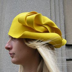 High quality felt hat made from 100% natural wool fabric.  An asymmetric pattern in colors and design according to preference.  Appropriate for casualwear, weddings, parties, or funeral.  It can be worn as you please:  sideways or backward. Modern Fitted Hats For Spring, Spring Fitted Fur Felt Hats, Brimmed Wool Felt Hat For Spring, Fitted Wool Party Hat, Spring Wool Felt Hat With Curved Brim, Chic Wool Felt Hat With Curved Brim, Fitted Wool Cloche Hat, Chic Felt Hat With Short Brim, Chic Fitted Wool Hat