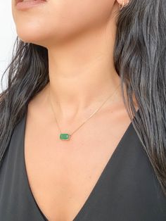 This elegant, timeless necklace features a stunning 3.76ct rich green Zambian emerald that is the focal point of the design. The emerald is set into a classic prong design that can be worn vertically or horizontally on the chain to suit any occasion. With this necklace, you can easily transition from a day in the office to a night on the town. ♥ The pendant measures 7mm in width, 13mm in length, and is 5.5mm thick. ♥ The necklace chain shown is included and measures 17.5" with a slider bead that Emerald Pendant Necklace, Gold Pendant Set, Timeless Necklace, Emerald Necklace Pendant, Zambian Emerald, Halo Pendant, Emerald Pendant, Rich Green, Dramatic Look