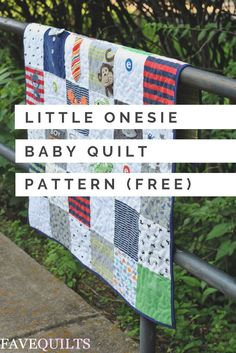 the little onesie baby quilt pattern is hanging on a rail with trees in the background