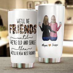 two personalized coffee mugs sitting on top of a wooden table with the words, we'll be friends until we're old and smile then we'll let new best friends