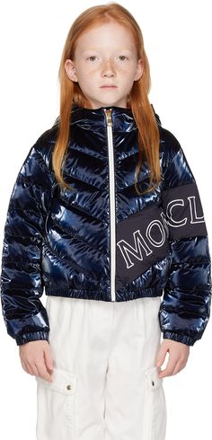 Down-filled quilted nylon laqué jacket. · Elasticized hood, hem, and cuffs · Zip closure · Logo printed at front and sleeve · Seam pockets · Full satin lining · Hand-wash Supplier color: Navy Model measures 48.5” / 123.2 cm tall and wears size 8Y. Size: child's height 4Y: 42 / 104 cm 6Y: 45.7 / 116 cm 8Y: 51.2 / 130 cm 10Y: 55.2 / 140 cm 12Y: 59.8 / 152 cm 14Y: 64.6 / 164 cm Fill: 90% goose down, 10% feather. Kids Outerwear, Down Jacket, Apparel Accessories, Kids Shop, Women Wear, Hand Wash, Outfit Accessories, Mens Outfits, Navy