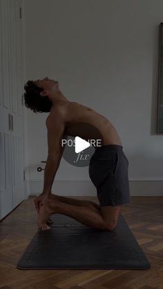 a shirtless man is doing yoga on a mat