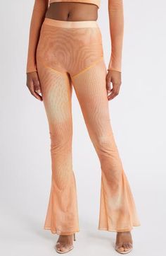 A subtle ombré effect amplifies the retro attitude of these perfectly flared mesh pants. Pull-on style Lined 80% polyamide, 20% elastane Dry clean Imported Artistic Multicolor Stretch Bottoms, Orange Bell Bottoms, Multicolor Non-stretch Festival Bottoms, Orange Stretch Yoga Leggings, Free People Orange Flare Pants, Mesh Pants, Subtle Ombre, Orange Ombre, Ombre Effect