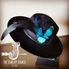 If you’re looking for the perfect accessory to complement your favorite boho style, look no further. This Boho-Style Western Felt Hat w/ Natural Feather & Turquoise Hat Accent by The Jewelry Junkie is absolutely everything that you need. Not only is it easy to incorporate into any and all outfits, but the genuine leather and natural feathers of the band immediately elevate whatever it is you’re wearing. One Size Hat with adjustable inner hat liner (see last photos) The same primary feathers will Western Hat, Leather Hat, Feather Hat, Packing Jewelry, Western Hats, Leather Hats, Turquoise Howlite, Black Feathers, Handbag Straps