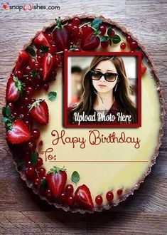 a birthday cake with strawberries on it and a photo frame in the middle that says happy birthday to you