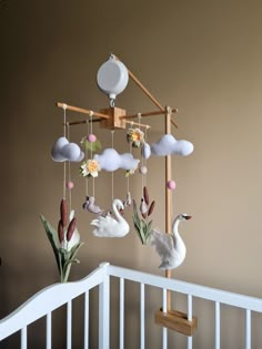 Hanging baby mobile with swans, lilacs, reeds is a beautiful and stylish nursery decor, perfect idea newborn gift, pregnancy gift. This crib baby mobile capture your little ones attention! It is so interesting to watch the movement of these adorable swans in the middle of the pond. There are water lilies and reeds. Everything is just like in nature. It's beautiful and amazing. Sizing details: The diameter of the wooden base ~ 35 cm (13,8 inch) mobile length ~ 45 cm ( 17, 7 inch) mobile weigth ~ Crib With Mobile, Baby Mobile Ideas, Swan Mobile, Swan Nursery Decor, Fairy Mobile, Swan Nursery, Baby Room Closet, Gift For Newborn Baby, Newborn Room