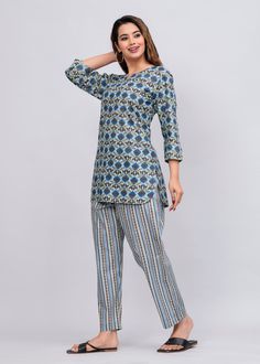 - Item Details :- Shuttle Gray Printed Pure Cotton Night Suit Set For Women Cotton Kurti For Women * Shuttle Gray Kurti * Pajamas have Pockets too * Ethnic motifs printed * Keyhole neck, three-quarter, regular sleeves * Pure Cotton - Materials Used To Make This Top :- * Kurti Fabric : 100% Pure Cotton * Pyjama Fabric : 100% Pure Cotton - Fabric Care :- Machine Wash in cold water (30 degree C or low) to avoid shrinkage. Line-dry in shade to avoid yellowing. For whites, wash with non-chlorine bleach on a hot water setting. Iron when slightly damp Package Includes : 1 Night Suit Set  SIZE CHART IN Kurti ( IN INCHES ) :- S - BUST 38 , WAIST 39 , LENGTH 30.5 M - BUST 40 , WAIST 41 , LENGTH 30.5 L - BUST 43 , WAIST 43 , LENGTH 31 XL - BUST 45 , WAIST 45 , LENGTH 31 XXL - BUST 47 , WAIST 47 , LEN Bohemian Printed Palazzo Set, Bohemian Printed Palazzo Set For Navratri, Fitted Bohemian Ikat Print Sets, Bohemian Palazzo Set With Block Print, Blue Bohemian Palazzo Set With Block Print, Blue Bohemian Kalamkari Print Sets, Bohemian Cotton Palazzo Set With Kalamkari Print, Fitted Bohemian Block Print Set, Women Summer Tops