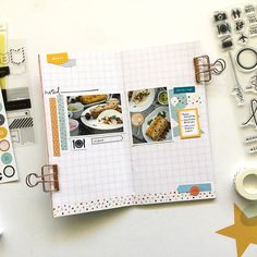 an open scrapbook with photos and stickers on the pages, next to other items