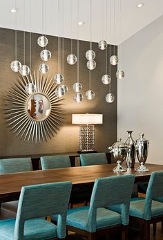 an image of a dining room setting with chandelier and lights on the wall