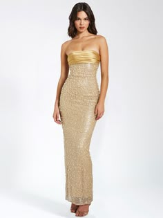 Introducing our show-stopping Lainey strapless maxi dress, your new go-to for the holiday season and beyond! With a bodycon fit and cups inserted at the bust for comfort and support, this dress also features a small slit at the back for easy mobility. Fully lined and made of a gorgeous sequin beaded fabric adorned with multi-sized pearls and luxe double duchess satin, it exudes elegance and glamour. Perfect for a range of occasions, from holiday parties to a night out on the town, and even for r Gold Wedding Party Attire, 18th Ideas, Gold Maxi Dress, Beaded Maxi Dress, Beaded Fabric, Duchess Satin, Bubble Dress, Strapless Maxi, Gold Satin