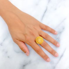 This 22k gold statement ring features a brilliant decadent design, perfect for adding elegance to any outfit. Weighing 5.9 grams, it showcases a yellow gold finish that enhances its luxurious and intricate appearance. Sized at 5.75, with adjustable sizing from 4.75 to 6.75, and a ring diameter of 0.9 inches, this ring combines style and practicality, making it ideal for special occasions or everyday wear. Suitable for those who appreciate opulent and refined jewelry, this ring brings a touch of brilliance and decadence to your collection. PRODUCT DETAILS Gold Purity(karat): 22k Gold Weight(grams): 5.9 Item Finish: Yellow Gold Ring Size: 5.75 Ring Diameter: 0.9" Adjustable Ring: Yes, Size 4.75 - 6.75 Indian Rings, Bridal Jewelry Necklace, Precious Stones Rings, Diamond Pendant Sets, Modern Bracelets, Fancy Necklace, Fancy Rings, Mens Gold Rings, Diamond Necklace Set