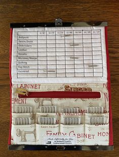 a wooden table topped with a box filled with lots of different types of toothbrushes