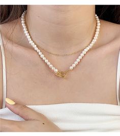 This timeless piece of jewelry is made with an S925 sterling silver chain and a sophisticated OT toggle clasp. The pearl and gold accents will add a subtle touch of luxury and elegance to any outfit. Made of 925 Sterling Silver & real Pearl Tarnish-proof Water-proof Safe for sensitive skin Create with 18K gold/white gold plated Product keywords: pearl necklace, pearl drop necklace, half pearl half chain necklace, Gold Pearl necklace, pearl necklace for women, pearl cross necklace, pearl drop nec White Pearl Gold Necklace, Pearl Gold Necklace, Pearl Cross Necklace, قلادات متدلية, Pearl Drop Necklace, Blood Diamond, Gold Pearl Necklace, Necklace Pearl, Creating Jewelry