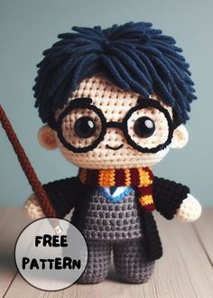 a crocheted harry potter doll holding a wand with the caption free pattern