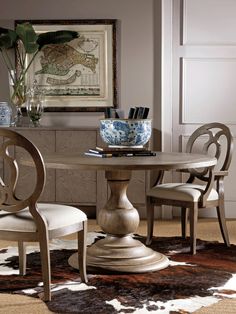 a dining room table with chairs around it