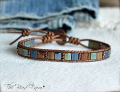 a leather bracelet with multi colored beads