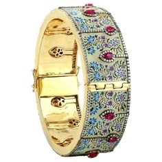 This Maharaja bangle bracelet features unique hand painted miniature art set with 18K gold and sterling silver. It is set with 2.45 carats rubies and 4.18 carats of sparkling diamonds. Clasp closure. FOLLOW MEGHNA JEWELS storefront to view the latest collection & exclusive pieces. Meghna Jewels is proudly rated as a Top Seller on 1stDibs with 5 star customer reviews. All items manufactured by us are handmade and can be customized or redesigned. Size-58X21 MM Total Weight-66.86 Gold Weight(Gms)-2 Turquoise Diamond Earrings, Mughal Jewelry, Modern Bangle, Mens Bangles, White Gold Bangle, Modern Bracelets, Diamond Bangles Bracelet, Enamel Bangle, Diamond Jewelry Designs