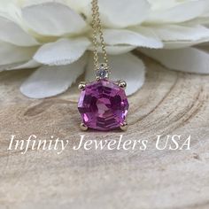 "The pendant pictured is lab created pink sapphire #6673. -Approximate total carat weight: 2.75ctw diamond equivalent -Stone Size: 9mm approx. 2.70ct diamond equivalent -Stone Shape: octagon/web cut -Gem Type: lab created pink sapphire -Stone Color: Pink -Stone Clarity: VS2 -Moh's Scale: 9 hardness Accent Stone -Stone Size: approx. .03ctw -Stone Shape: round -Gem Type: Diamond -Stone Color: G -Stone Clarity: SI1 -Moh's Scale: 10 hardness -Metal Type and Purity: 14k yellow gold -Setting: basket h Dazzling Pink Sapphire Round Cut Jewelry, Dazzling Pink Gemstone Jewelry, Purple Pink Sapphire Jewelry With Brilliant Cut, Dazzling Oval Pink Sapphire Jewelry, Diamond Cut Lab-created Sapphire Necklace As Gift, Pink Sapphire Jewelry With Brilliant Cut, Gift Necklace With Lab-created Sapphire And Diamond Cut, Asscher Cut Diamond Jewelry In Pink, Pink Asscher Cut Diamond Jewelry