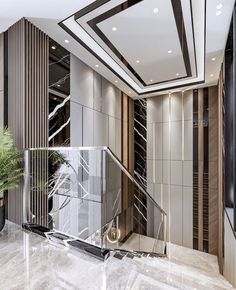 an elegant foyer with marble flooring and walls, along with glass balconies