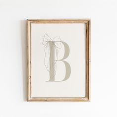 the letter b is drawn in grey ink on a white paper with a wooden frame