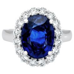 Experience the embodiment of elegance with our exquisite Blue Sapphire Ring. It features a stunning 7.03 carat natural blue sapphire from Sri Lanka, delicately set in a Platinum band adorned with 1.05 carats of dazzling diamonds. The oval-cut sapphire, measuring 12.74 x 9.64 x 6.11 mm, radiates exceptional clarity and brilliance. Sized at 6.5, this ring encapsulates luxury, making it the perfect accessory to enhance your special occasions with timeless beauty and unmatched elegance. Blue Sapphire Stone, Blue Sapphire Ring, Platinum Ring, Blue Sapphire Rings, Natural Blue Sapphire, Sapphire Stone, Cocktail Rings, Oval Cut, Timeless Beauty