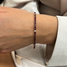 This Beautifully Crafted Tennis Bracelet Features Round Cut Rubies And Diamonds Encrusted In Four Prong Setting. Crafted In 14k Yellow Gold. Total Diamond Weight: 0.31 Carat. Diamond Quality: G-H Color And Vs-Si Clarity. Total Ruby Weight: 6.75 Carats. Length: 7 Inches. Width: 3 Mm. Total Weight: 9.02 Grams. Bracelet Closes Securely With A Box Clasp. This Tennis Bracelet Is A Timeless Piece That Holds A Place In The Collection Of Every Jewelry Lover. Comes With A Presentable Gift Box. Id: 01310 Luxury Red Diamond Bracelet For Formal Occasions, Luxury Red Diamond Jubilee Bracelet, Fine Jewelry Red Diamond Bracelet For Formal Occasions, Luxury Red Tennis Bracelet For Anniversary, Red Luxury Tennis Bracelet For Formal Occasions, Luxury Red Tennis Bracelet, Red Luxury Jubilee Tennis Bracelet, Classic Red Diamond Bracelet For Anniversary, Elegant Red Tennis Bracelet For Anniversary