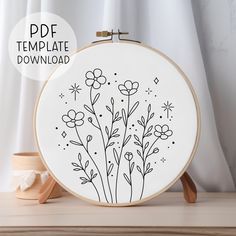 an embroidery pattern with flowers on it and the text, free template for this project