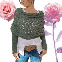 a woman wearing a green knitted shawl with pink roses on the side and behind her