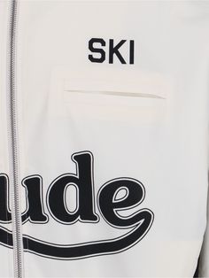 Rhude Ski Track jacket, in white fabric, turtleneck, double zip fastening, front logo print, two welt chest pockets, two side pockets, contrasting black sleeve details, elasticated waist detail on hem, straight hem. Composition: 100% Polyester White Functional Track Jacket With Pockets, Urban White Track Jacket With Pockets, White Athleisure Track Jacket With Pockets, White Outdoor Outerwear With Side Pockets, Sporty White Track Jacket With Letter Print, White Outerwear With Side Pockets For Streetwear, White Zipper Track Jacket For Winter, White Functional Track Jacket With Ribbed Cuffs, White Sporty Outerwear With Logo Detail