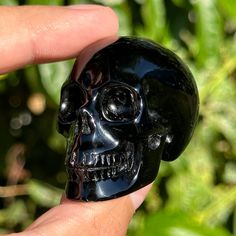 High gloss polish Black Obsidian Crystal Skull. Realistic High Detail Carving guardian healing skulls.  Size: 2.0"x1.3"x1.6" Weight: 71g Material: black obsidian *{High Detail} hand carved & polished from one solid piece  Metaphysical: powerful grounding, protection Crystal Skull guardian companion You will receive the exact item in the images. Natural formations, inclusions, imperfections, rainbows are all part of natural crystals making them individually unique & beautiful.  Thank you & be sur Halloween Black Skull Ring, Black Skull Ring For Halloween, Black Obsidian Crystal, Skull Realistic, Gemstone Carving, Obsidian Crystal, Protection Crystals, Crystal Skull, Black Obsidian