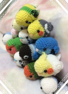 small crocheted stuffed animals sitting on top of each other