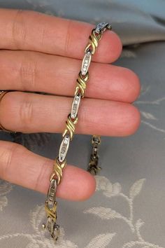 This is a fine vintage 10k yellow and white gold (marked and electronically tested) bracelet set with pretty baguette diamonds (tested as diamonds). Each of the ten (10) white gold oval links are set with seven (7) tapered straight baguette diamonds with an average colour grade of J-K and a clarity of approximately I1. My estimate is the bracelet contains a total of approximately 1.5 or slightly more carats of diamonds. This classic bracelet weighs 7.37 grams and measures 7.0 inches in length wi Gold And Diamond Bracelet, Sweet Ring, Classic Bracelets, Special Ring, Bracelets Gold Diamond, Baguette Diamonds, Wedding Jewelry Bracelets, Box Clasp, Diamond Settings