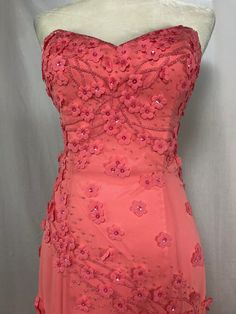 Coral strapless dress with a sweetheart neckline, this mermaid style gown is covered in beadwork and flower detail throughout.  Truly a wonder to behold! This is a high quality private label designer apparel and items are tagged with UK sizing but listing reflects US sizing to simplify size selection.   Please check out our additional inventory and learn more about the company at at jerryhollandfoundation.org .  You can also use the coupon code 35OFF on our website to get 35% off of the list price of your entire order! Floral Embellished Evening Dress For Prom, Fitted Evening Dress With Floral Applique And Sweetheart Neckline, Evening Dress With Sweetheart Neckline And Floral Applique, Evening Dress With Floral Applique And Sweetheart Neckline, Sweetheart Neckline Evening Dress With Floral Applique, Floral Embellished Sweetheart Neckline Evening Dress For Prom, Floral Sweetheart Neckline Evening Dress For Prom, Prom Gown With Floral Applique And Sweetheart Neckline, Prom Season Gown With Floral Applique And Sweetheart Neckline